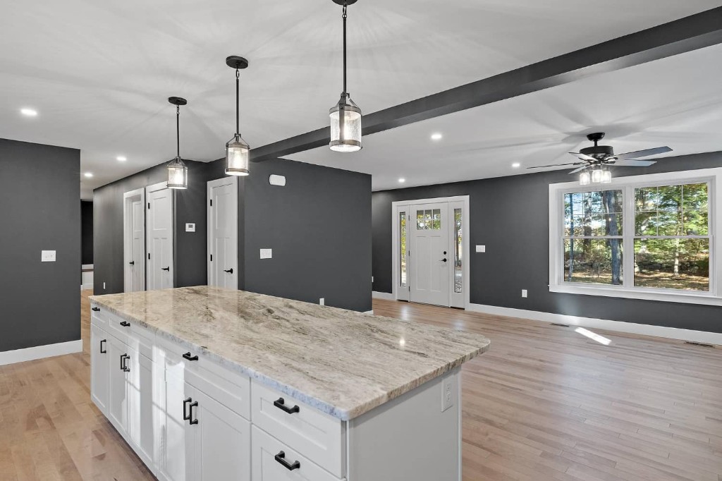 Freshly remodeled home interior with granite countertops and open living space